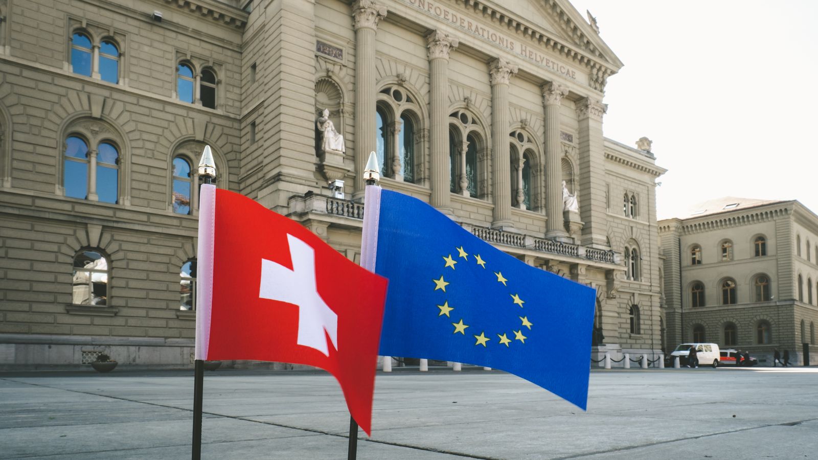 European Union flag in front of an institutional building, illustrating the ViDA VAT in the Digital Age reform